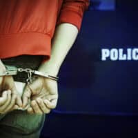 AManBeingArrestedAndHandcuffedByThePoliceLaw