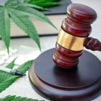 JudgesGavelIsSittingOnSoundBlockWithCannabisLeaves