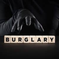 TheftCrimeRobberyOrBurglaryConceptThiefHandWithBlack