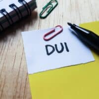 DuiWrittingOnTableBackground